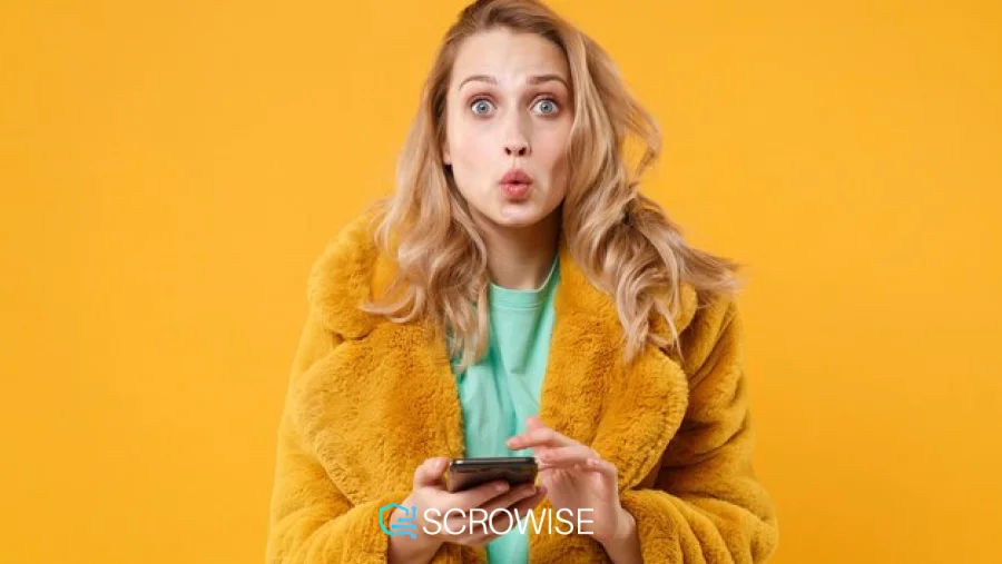 a girl checking her phone looking surprised
